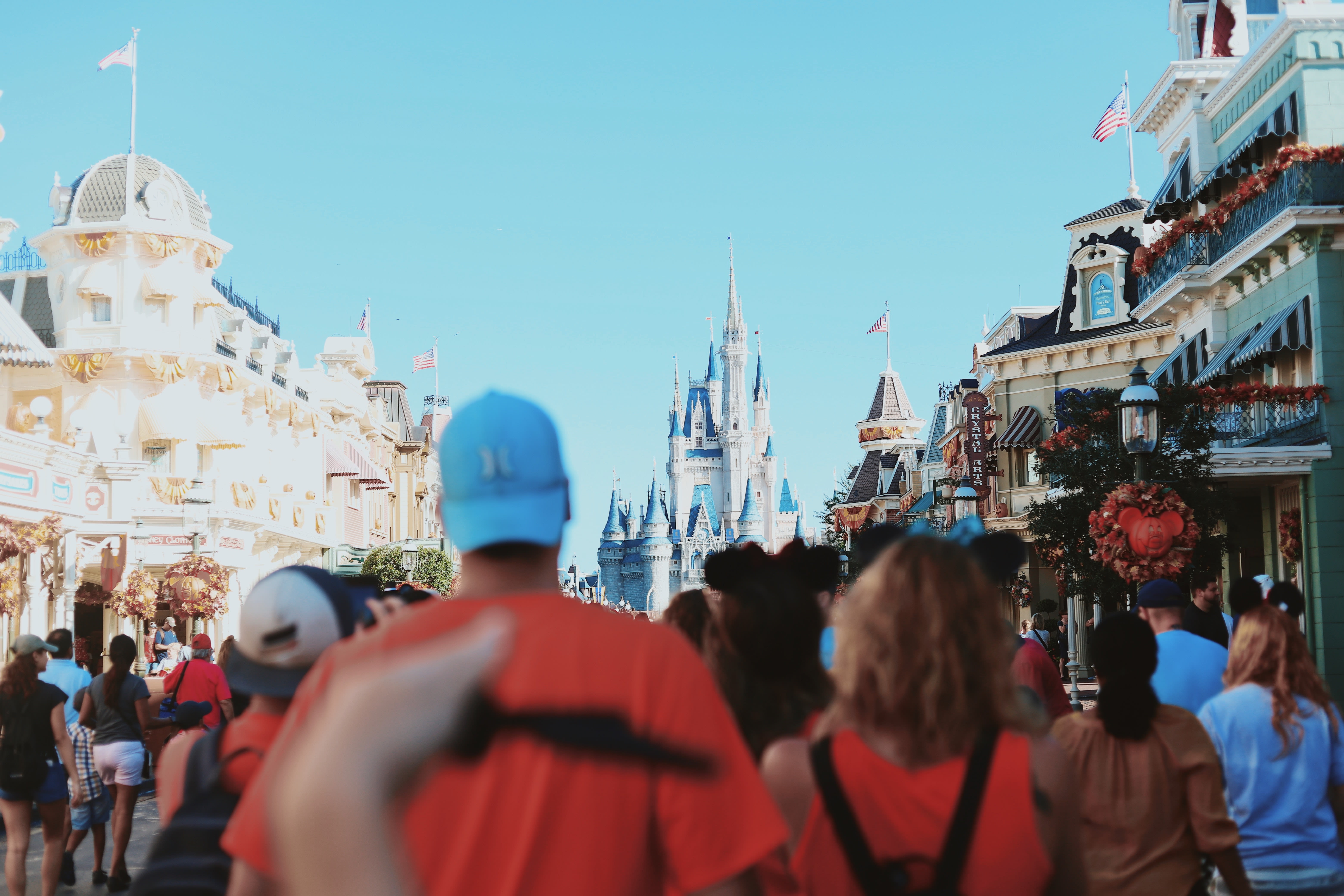 Image of Amusement Park, Fun, Theme Park, Urban, Adult, Male, Man, Person, Flag, Female, Woman, Hat, City, Bag, Handbag, Shoe, 