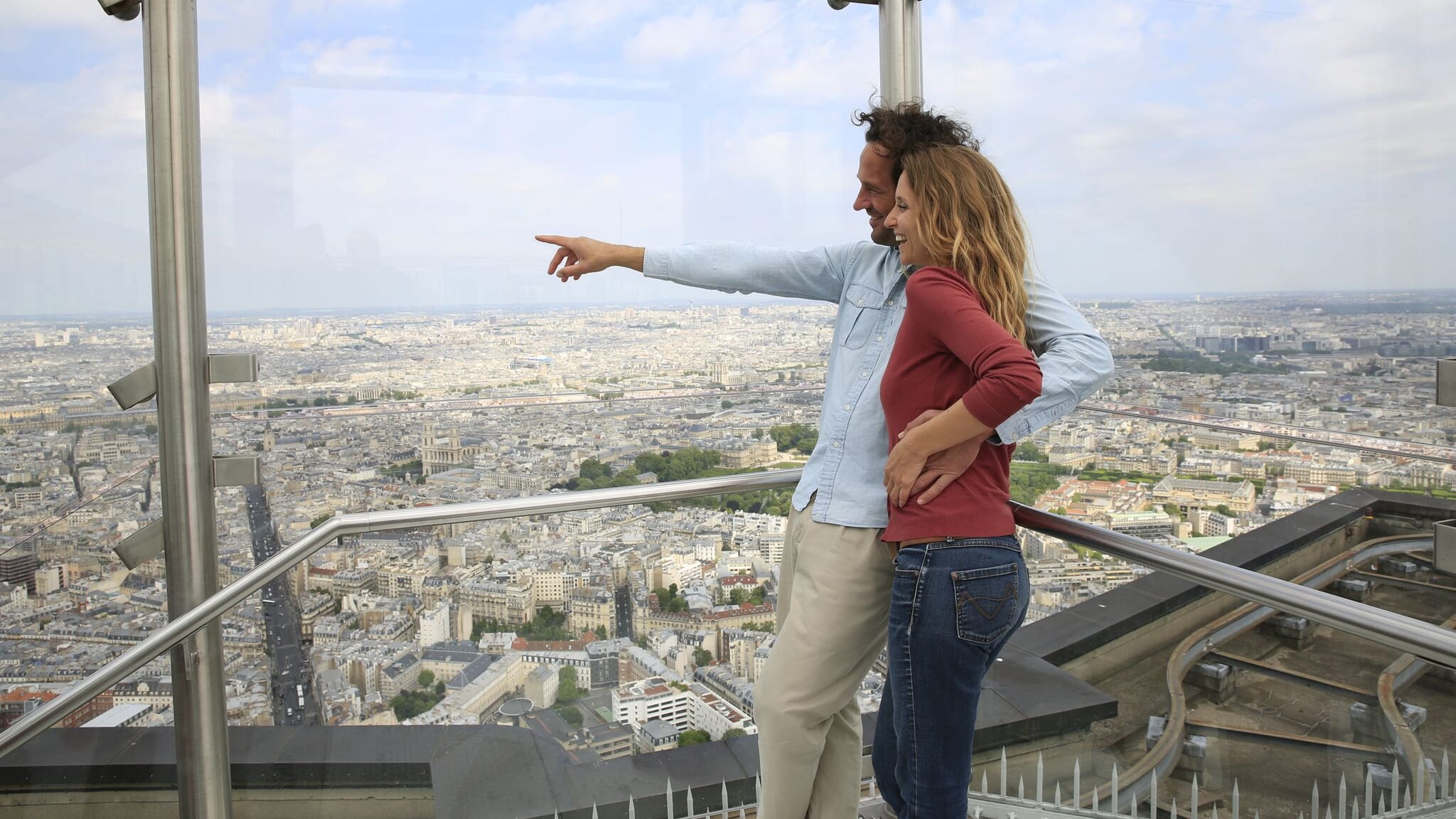 Image of Pants, City, Balcony, Face, Head, Person, Photography, Portrait, Urban, Cityscape, Blouse, Jeans, Adult, Female, Woman, Handrail, Coat, 