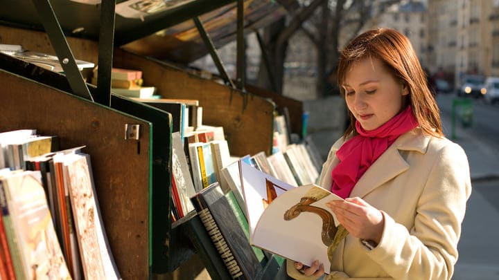 Image of Person, Reading, Book, Publication, Adult, Female, Woman, Indoors, Library, Car, 