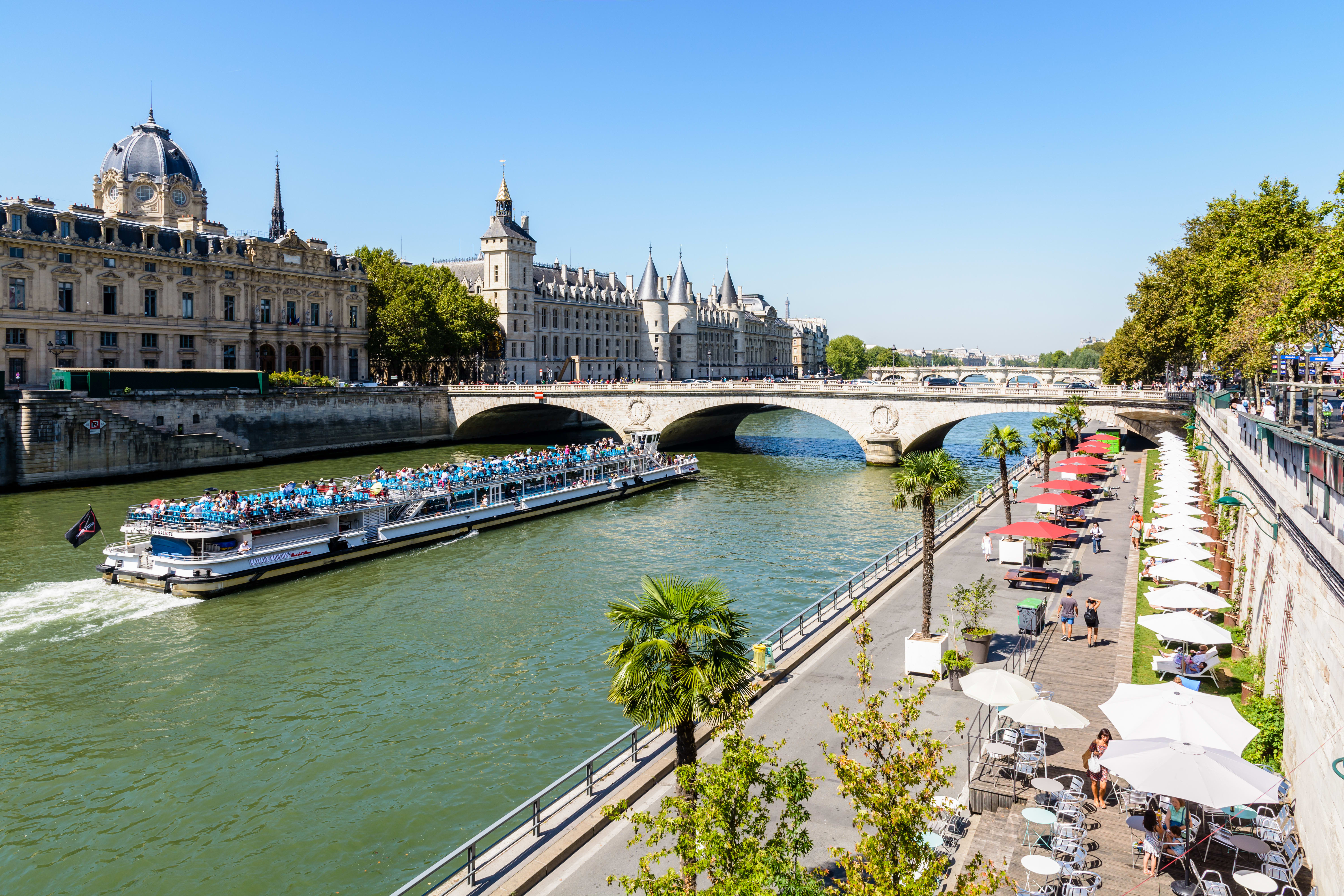 Image of City, Metropolis, Urban, Canal, Outdoors, Water, Waterfront, Boat, Vehicle, Plant, Person, Nature, Scenery, Watercraft, Cityscape, Car, 