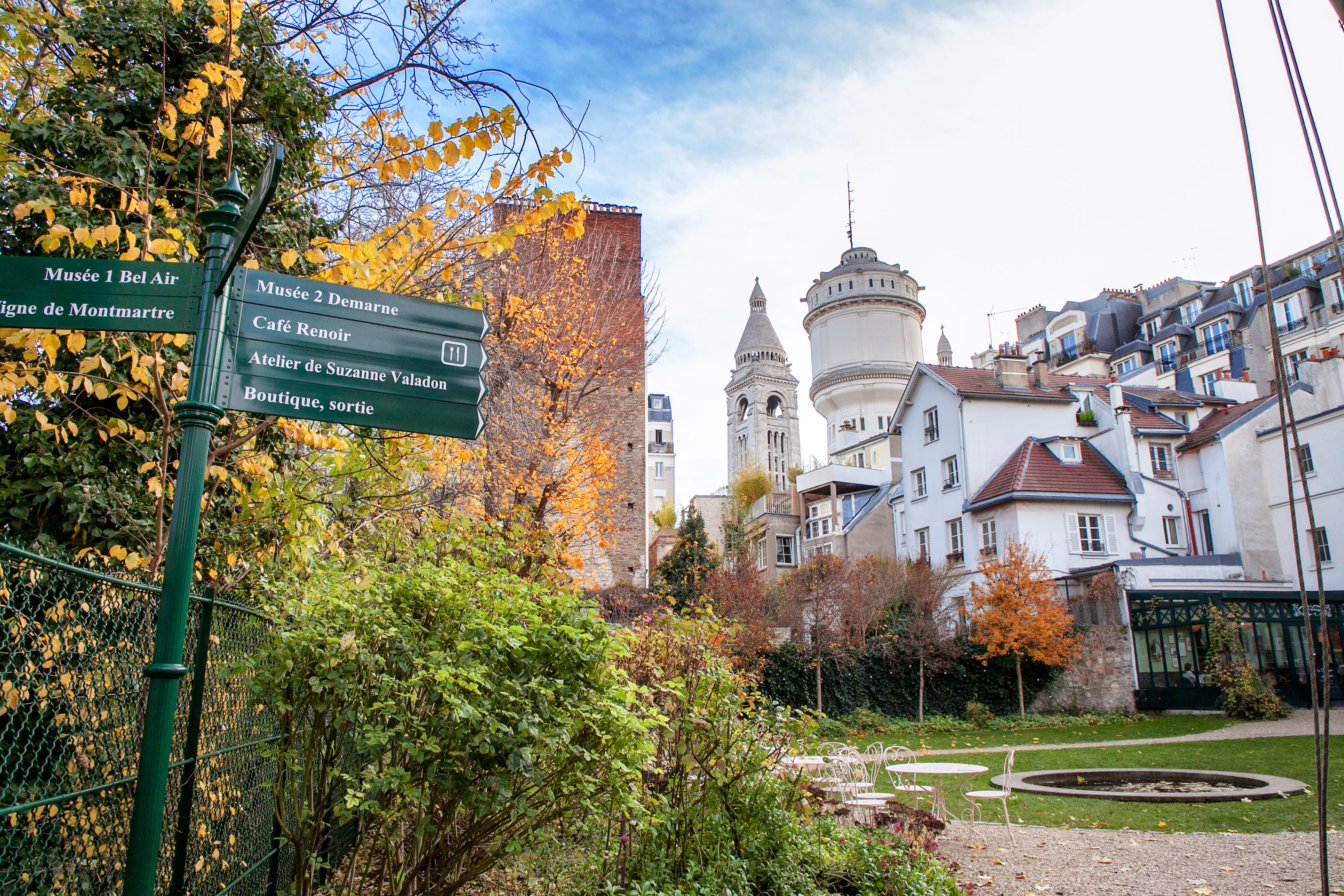 Image of Neighborhood, Monastery, City, Dining Table, Chair, Spire, Tower, Urban, Person, Tree, 