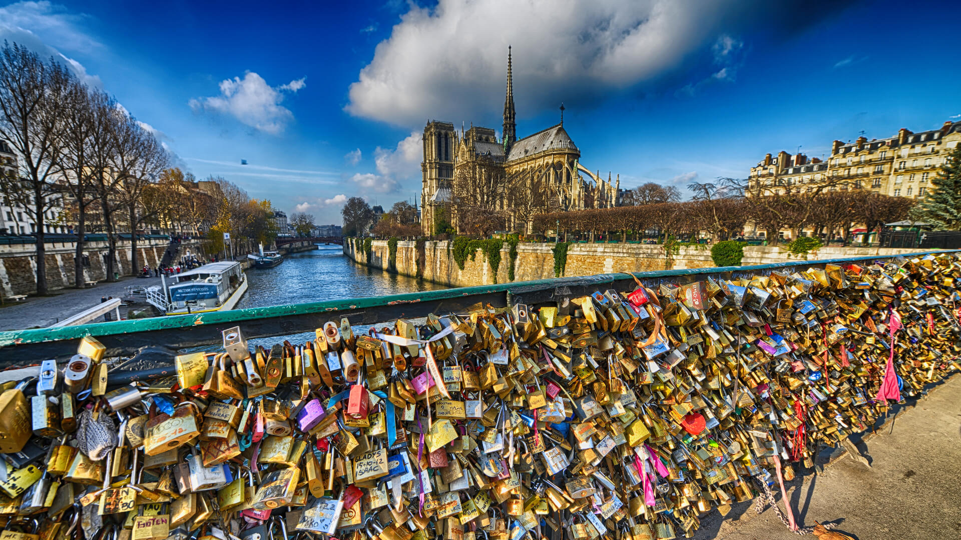 Image of City, Nature, Outdoors, Scenery, Water, Waterfront, Spire, Tower, Metropolis, Urban, Landscape, Boat, Vehicle, Cityscape,