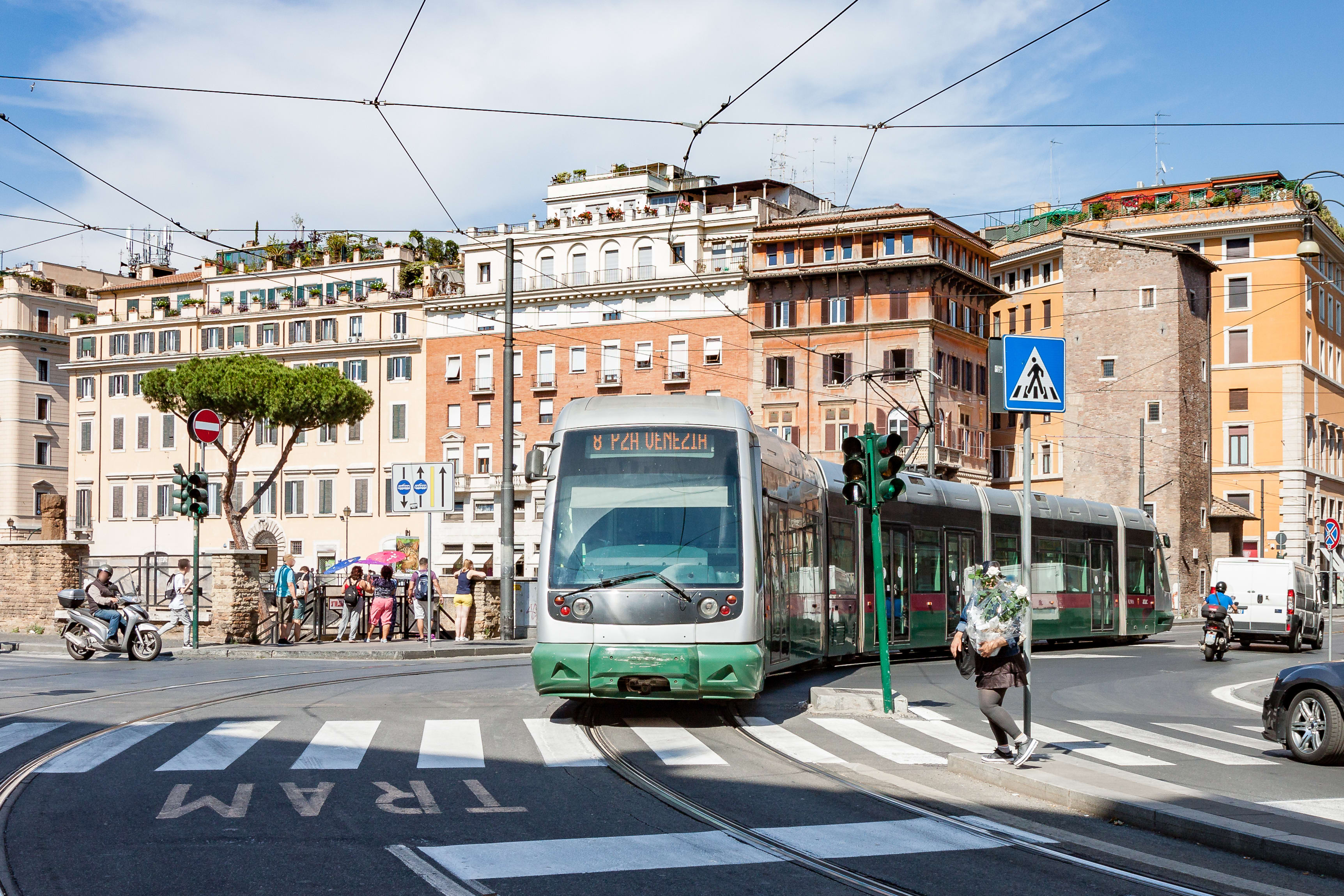 Image of Neighborhood, City, Metropolis, Urban, Road, Person, Traffic Light, Car, Vehicle, Tarmac, Motorcycle, Truck, Handbag, Bus, 