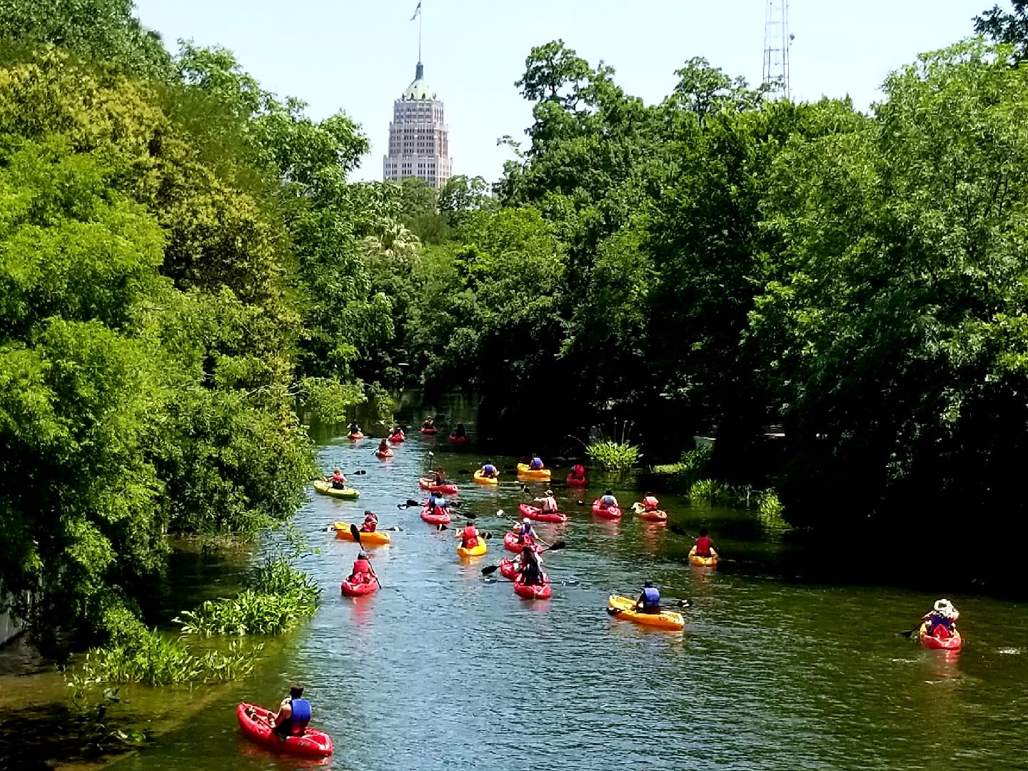 Image of Water, Boat, Vehicle, Canoe, Canoeing, Person, Rowboat, Water Sports, Vegetation, Helmet, Kayak, Outdoors, 