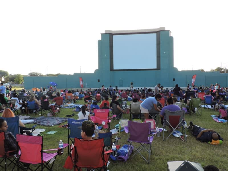 Image of People, Person, Concert, Crowd, Outdoors, Shelter, Adult, Female, Woman, Hat, Chair, Furniture, Male, Man, Grass, Handbag, Classroom, Indoors, School, 