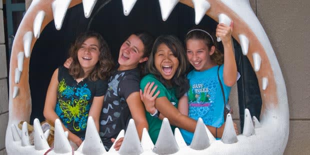 Image of T-Shirt, Mouth, Person, Teeth, Photography, Face, Head, Portrait, People, Child, Female, Girl, Adult, Woman, Happy, Laughing, 