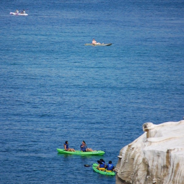 Image of Boat, Vehicle, Person, Water, Rock, Nature, Outdoors, Sea, Canoe, Kayak, Rowboat, Swimming, Water Sports, 