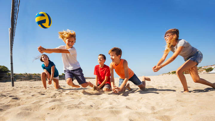 Image of People, Person, Playing Volleyball, Volleyball, Volleyball (Ball), Child, Female, Girl, Shorts, Boy, Male, Teen, 