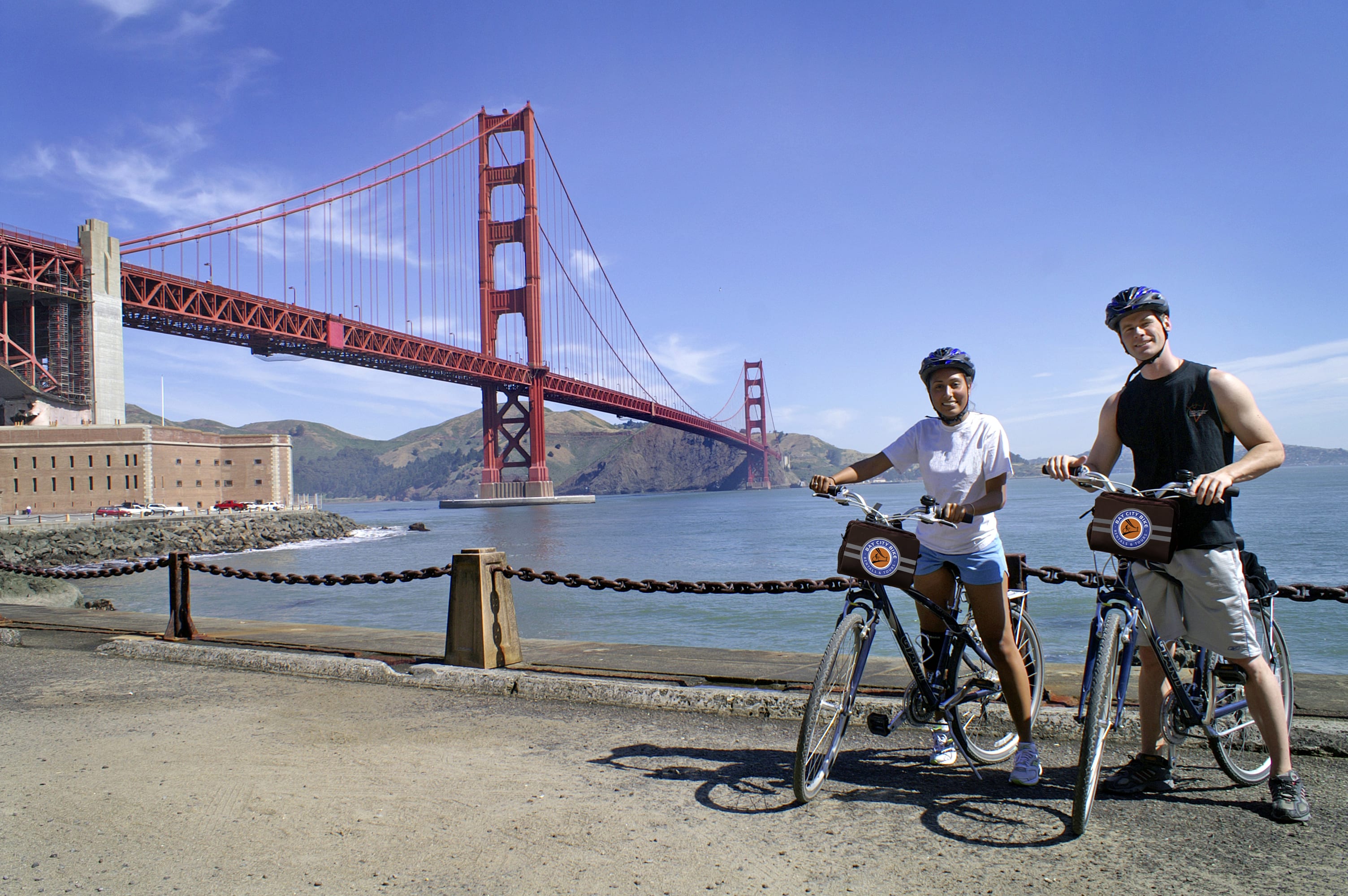 Image of Boy, Male, Person, Teen, Bicycle, Vehicle, Handbag, Bridge, Golden Gate Bridge, Landmark, 