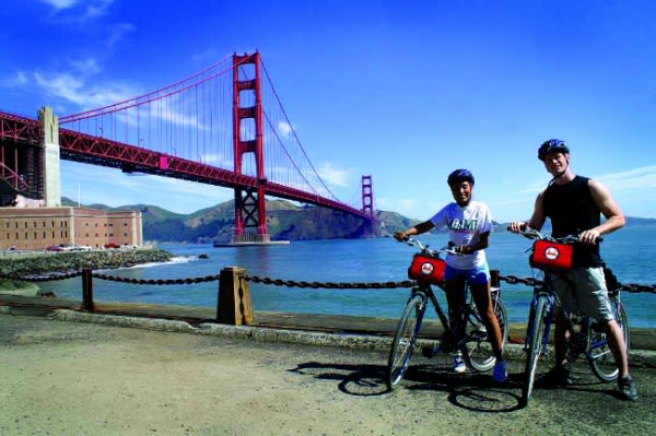 Image of Helmet, Handbag, Boy, Male, Person, Teen, Bicycle, Vehicle, Bridge, Golden Gate Bridge, Landmark, 