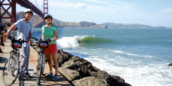 Image of Helmet, Boy, Male, Person, Teen, Adult, Female, Woman, Nature, Outdoors, Sea, Water, Bicycle, Vehicle, Shoe, Waterfront, 