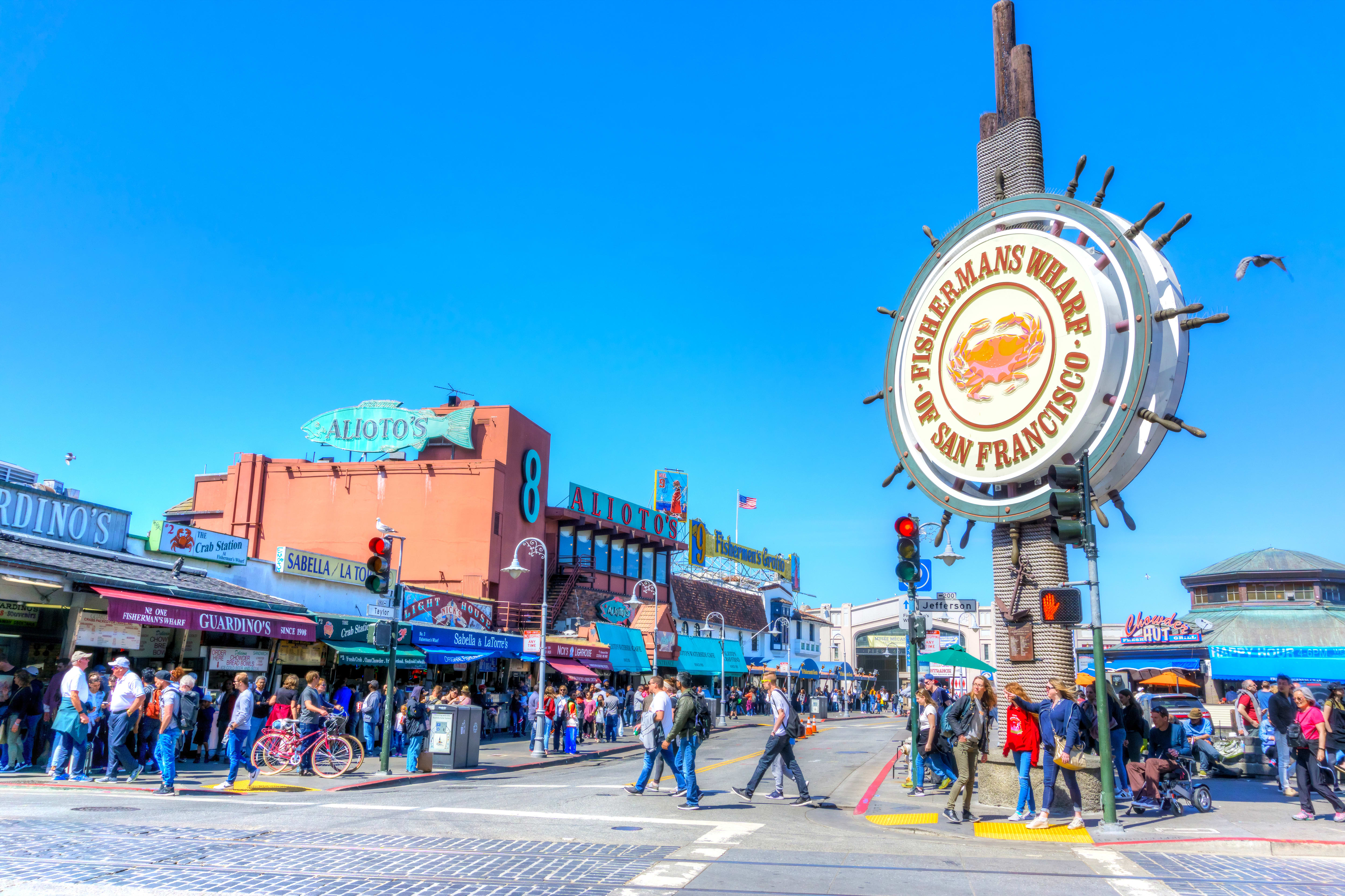 Image of City, Urban, Person, Traffic Light, Amusement Park, Fun, Theme Park, Bicycle, Walking, Road, Street, Bird, Boardwalk, Bridge, 