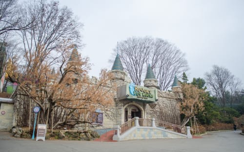 Image of Monastery, Spire, Tower, City, Person, Tree, 