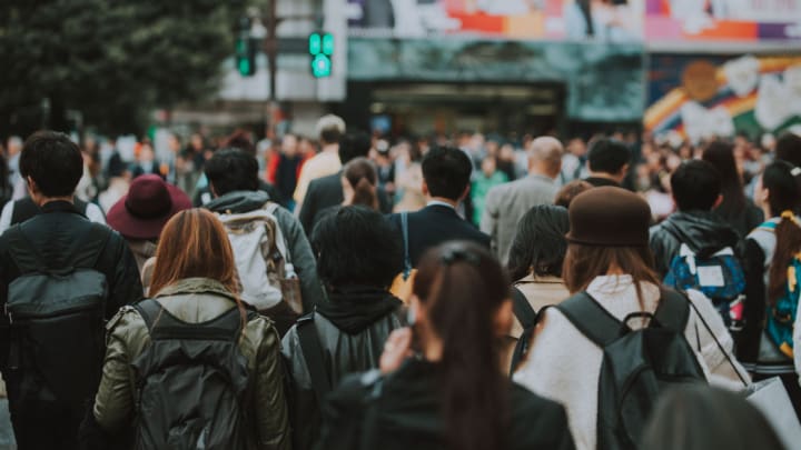 Image of People, Person, Adult, Male, Man, Female, Woman, Boy, Child, Traffic Light, Backpack, Bag, Handbag, Crowd, 