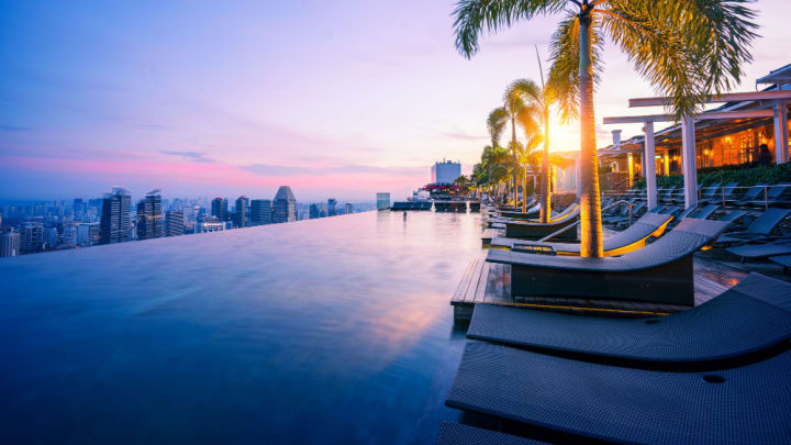 Image of Nature, Outdoors, Scenery, Water, Waterfront, Yacht, City, Summer, Sky, Tree, Urban, Palm Tree, Landscape, Cityscape, Pool, Tropical, Person,