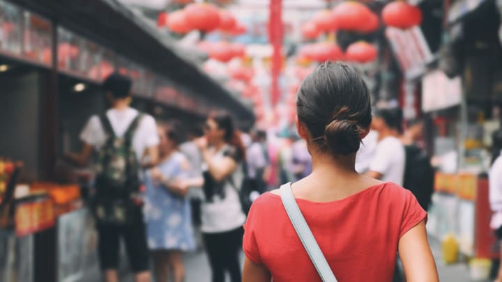 Image of Adult, Female, Person, Woman, Male, Man, Urban, Black Hair, Hair, Child, Girl, Bag, Handbag, Photography, Face, Head, Smile, City, 