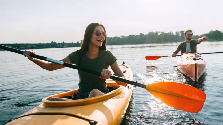 Image of Water, Adult, Male, Man, Person, Boat, Canoe, Kayak, Rowboat, Vehicle, Face, Head, Female, Woman, Kayaking, Water Sports, 