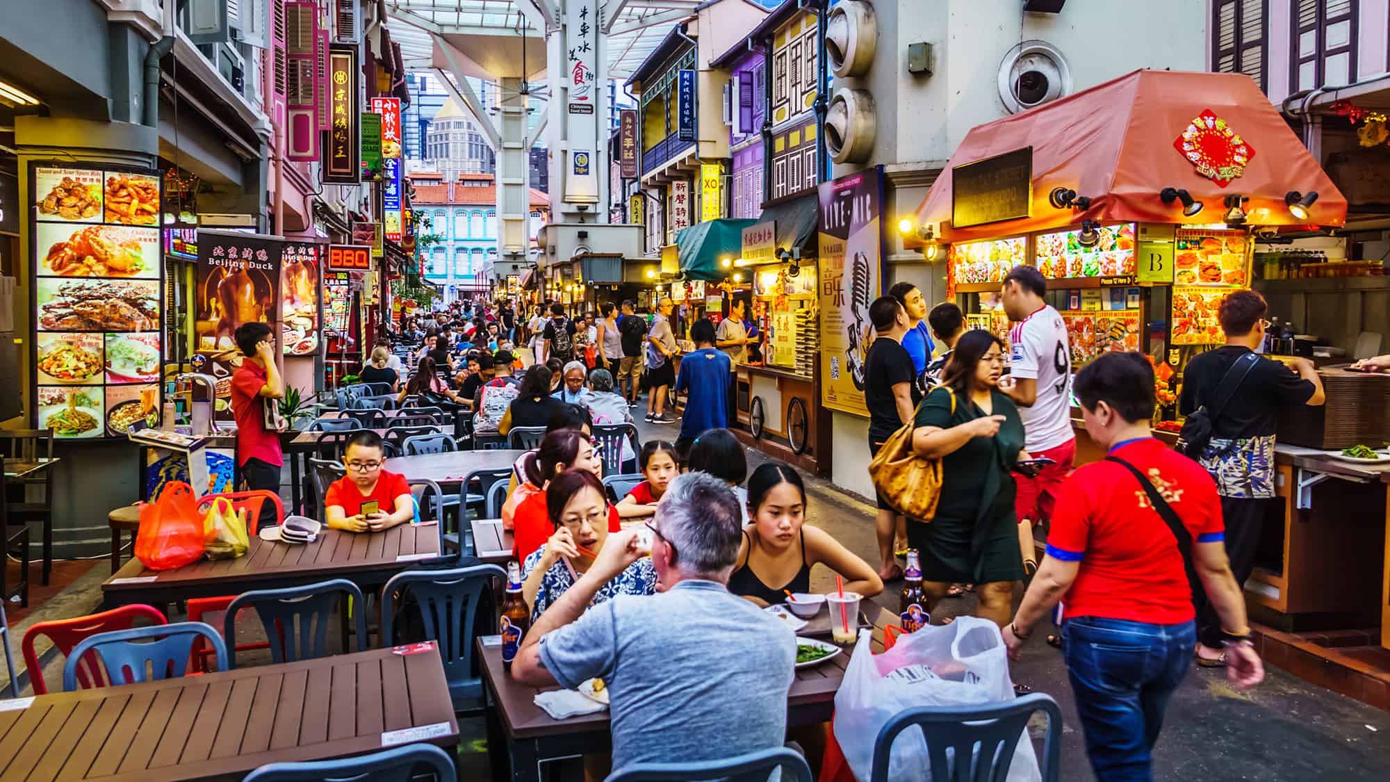 Image of Urban, Handbag, City, Night Life, Adult, Male, Man, Person, Glasses, Chair, Burger, Food, Plate, Female, Woman, Jeans, 