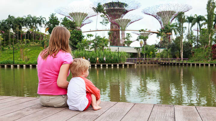 Image of Water, Waterfront, Nature, Outdoors, Scenery, Pond, Boy, Child, Male, Person, Vegetation, Female, Girl, People, Tree, Lake, Grass, Park, 