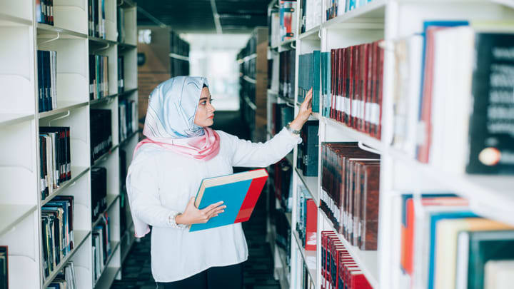 Image of Adult, Female, Person, Woman, Book, Indoors, Library, Publication, 