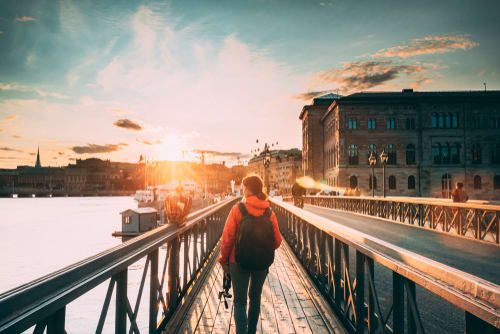 Image of Person, Walking, Water, Waterfront, Photography, Path, Nature, Outdoors, Sky, Adult, Female, Woman, City, Face, Head, Portrait, Backpack, Bag, Scenery, Urban, 