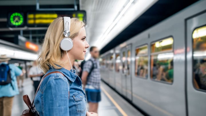 Image of Terminal, Electronics, Headphones, Railway, Train, Train Station, Vehicle, Adult, Male, Man, Person, Boy, Child, Backpack, Accessories, Handbag, Head, Face, 