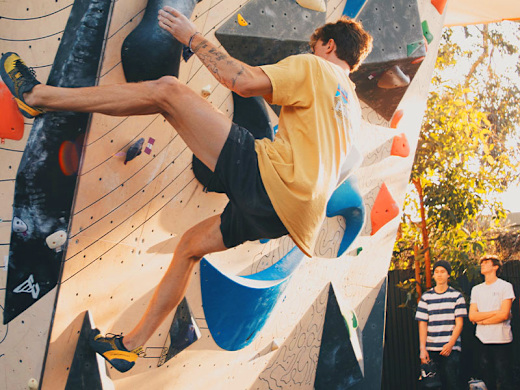 Climber on the boulder at Asylum in San Diego.
