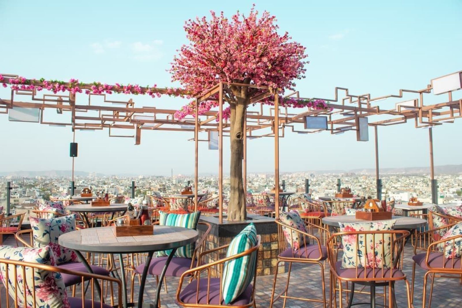 Rooftop restaurant in Jaipur with panoramic city views at night
