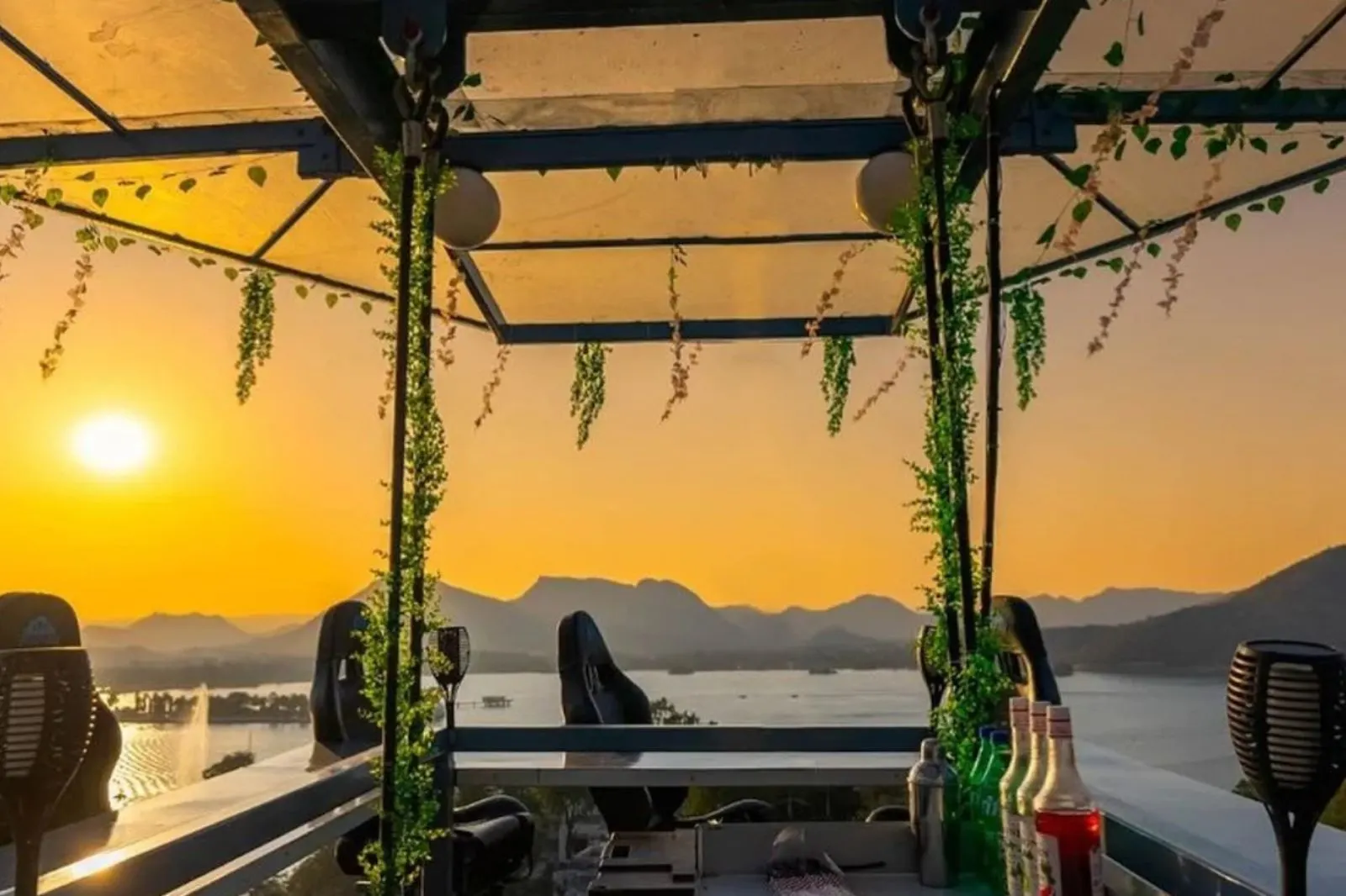 Aurosky sky dining — hanging restaurant suspended above Udaipur at night