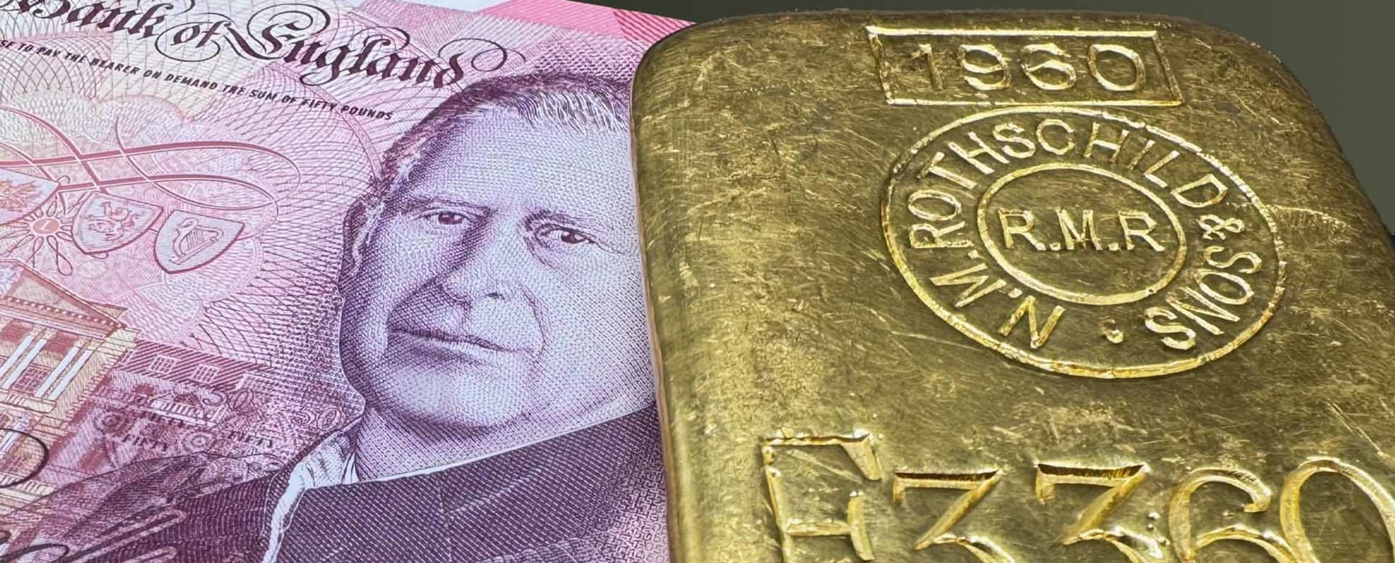 A one kilo gold bar sitting on top of a stack of £50 notes