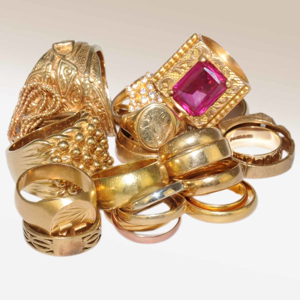 A select of gold signet, dress and wedding rings