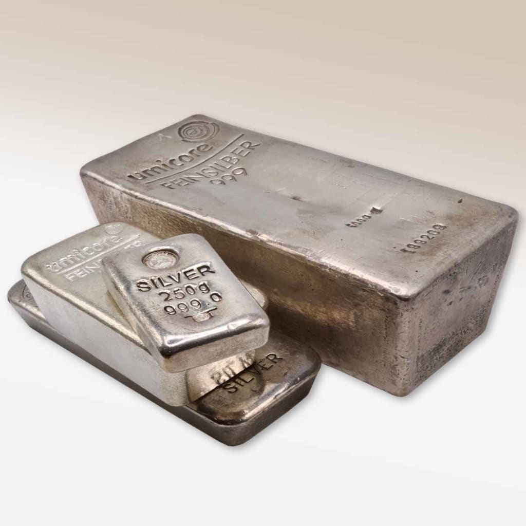 A stack of silver bars in various sizes 