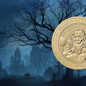The 1oz gold and silver Frankenstein coins, superimposed over a graveyard scene with a gothic castle in the background