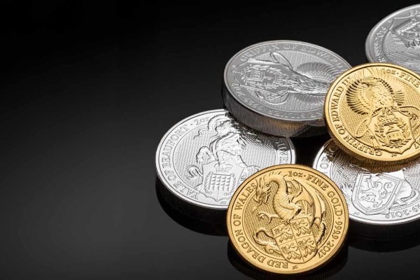 A pile of 1oz gold and 2oz silver bullion coins