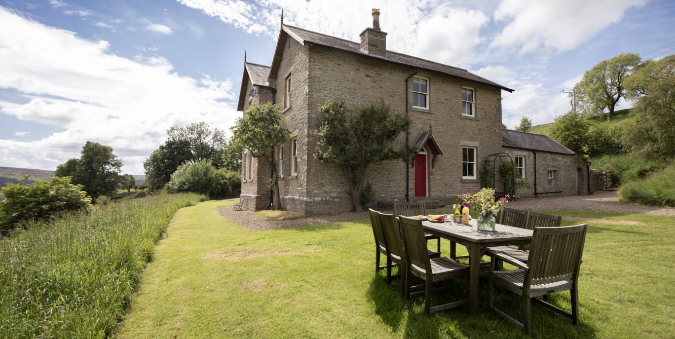 house with set table in front