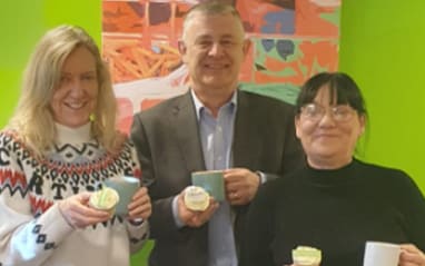 paul hazel and tracy at samaritans holding cup of team and cupcakes