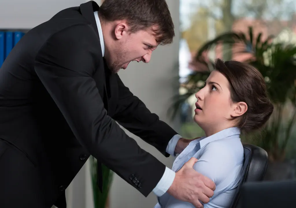 Image of a man yelling at a woman in the office.