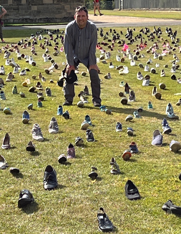 Graham surveys 'Momentum' - an artwork made from shoes of various eras by artist Susan Williams