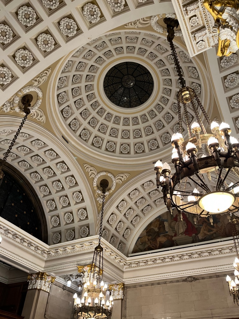 An ornate ceiling in the Hull Guildhall featuring plenty of Yorkshire roses