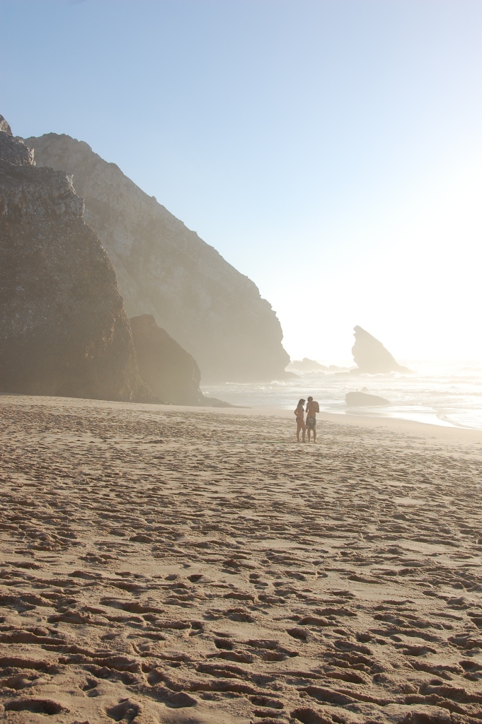 Young lovers on a beach in Portugal in summer.