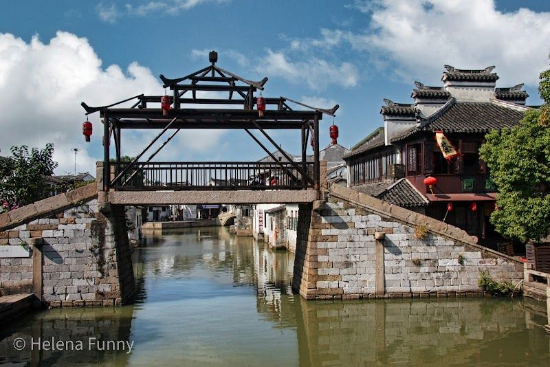 Take a traditional boat ride through Tongli's canals