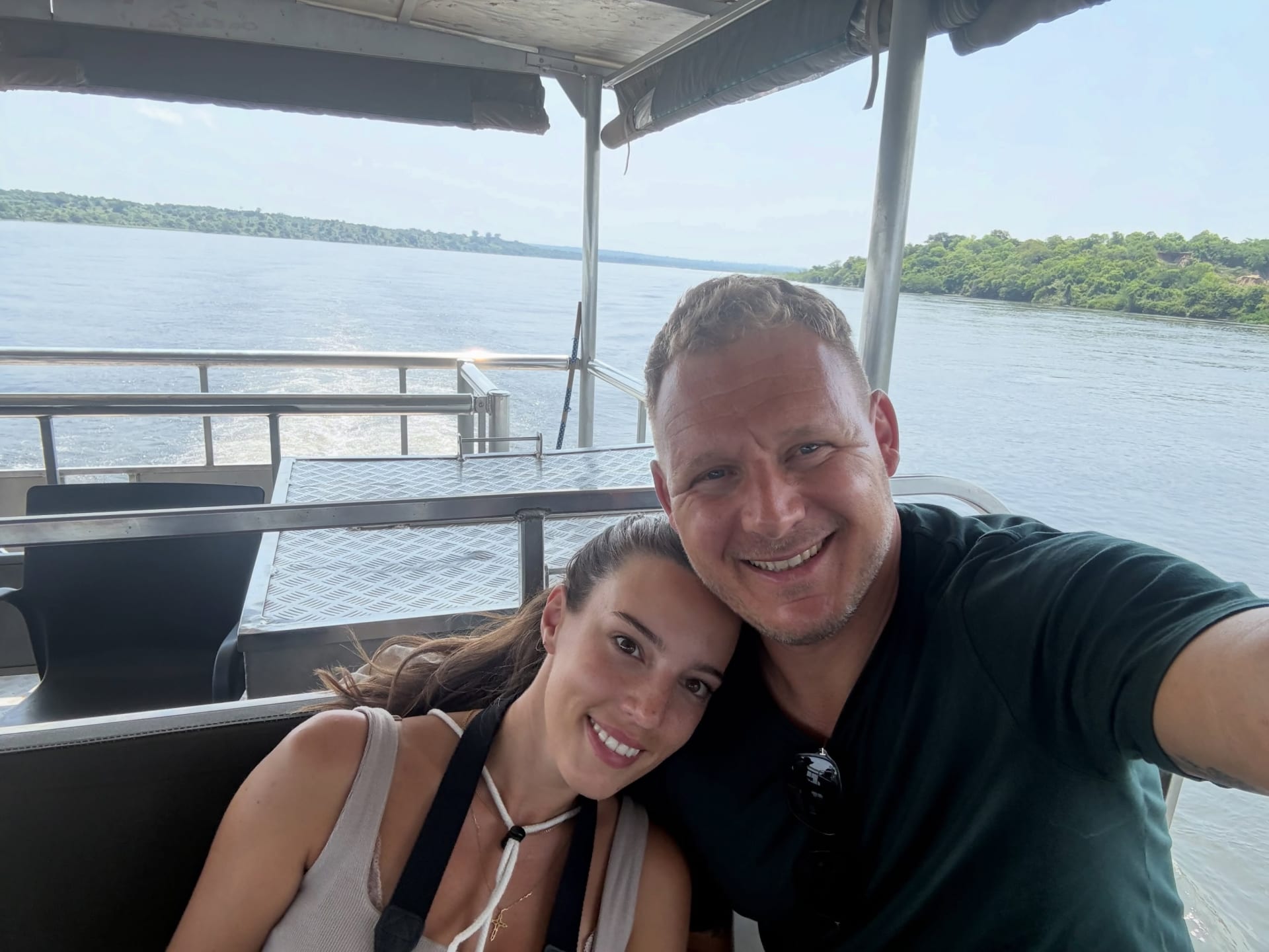 A couple taking a selfie on a covered boat on the Nile