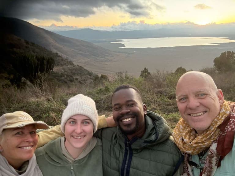 Four travellers taking a selfie on the rim of the Ngorongoro Crater in Tanzania