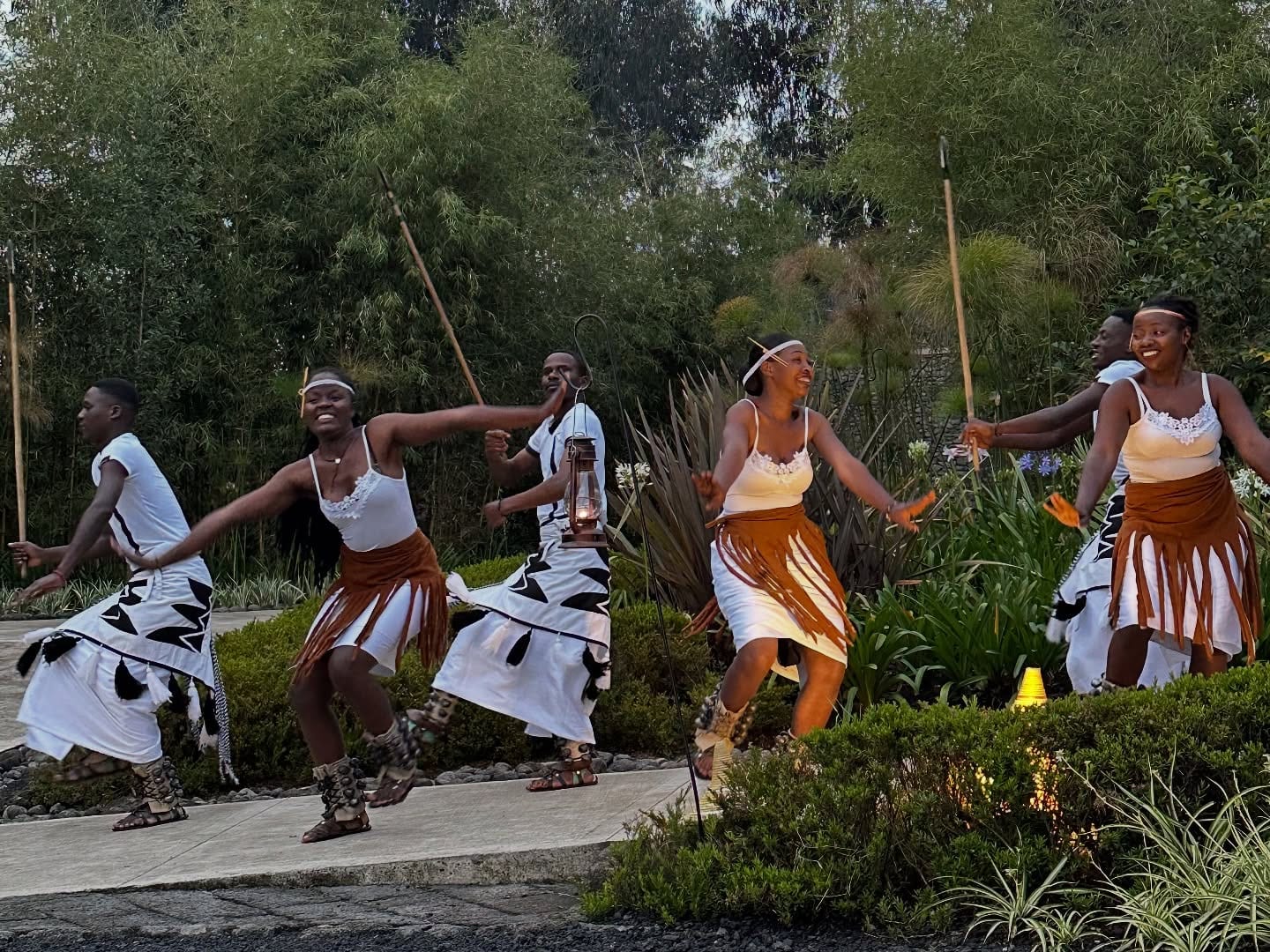 Dancers in traditional costume performing outdoors in Rwanda