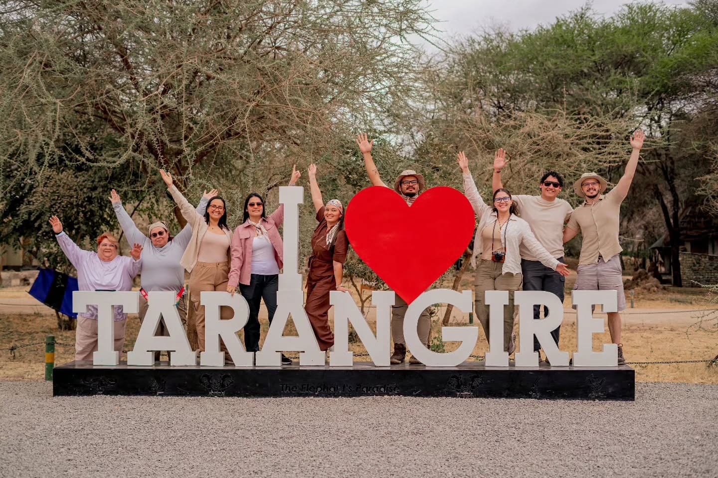A group of guests at the I Love Tarangire sign in Tarangire National Park
