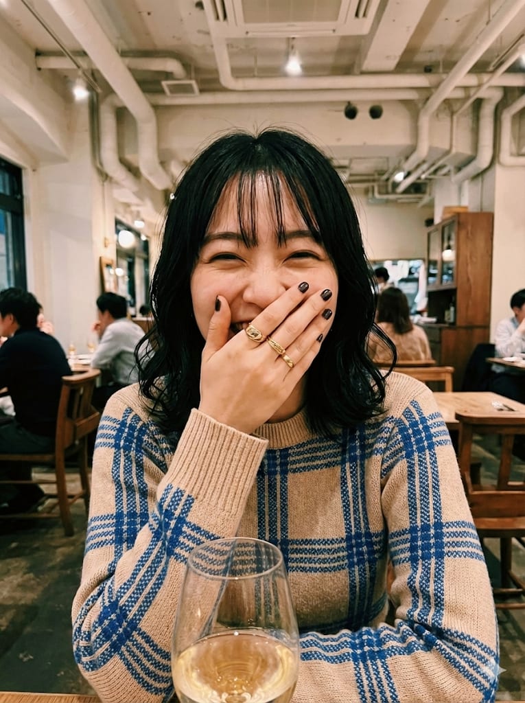 Industrial Chic Bistro Restaurant Dining Portrait – woman in a sweater in a restaurant, AI image made with Nano Banana Pro