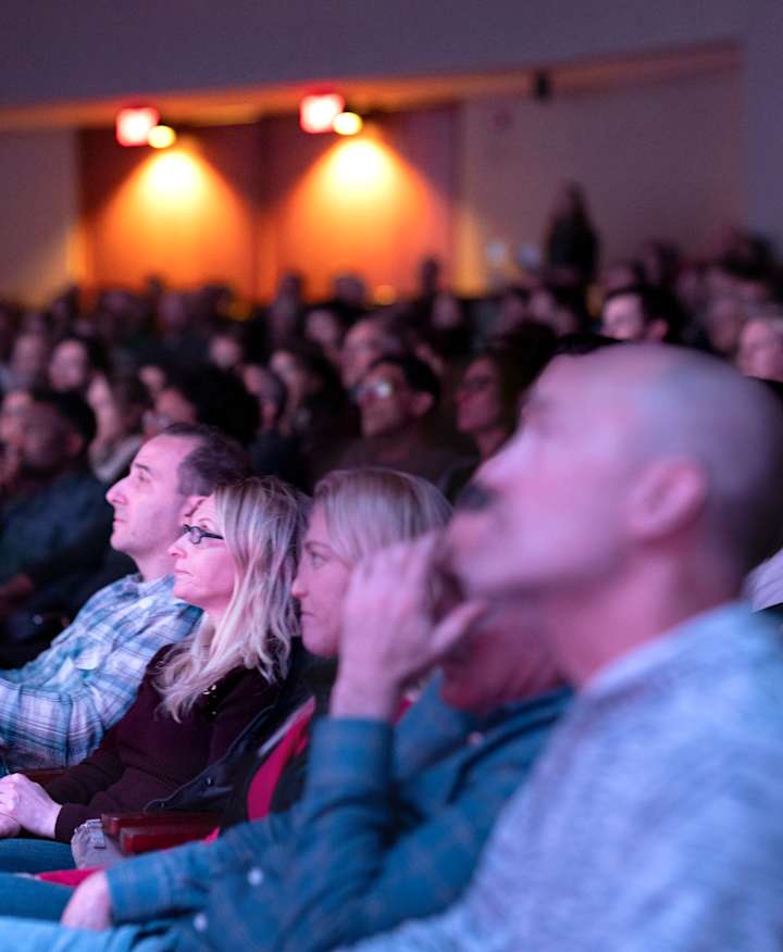 A full corwd seated at a Banff show.