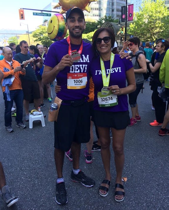 Braeden celebrates with his mom Devi at the finish line.