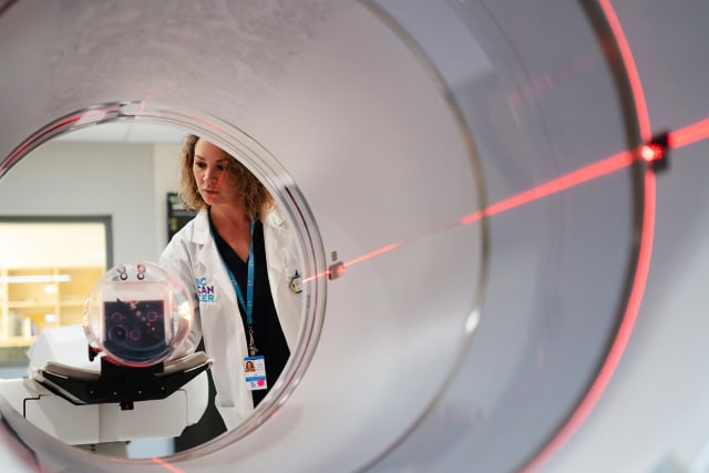 Radiologist performing a PET-CT scan