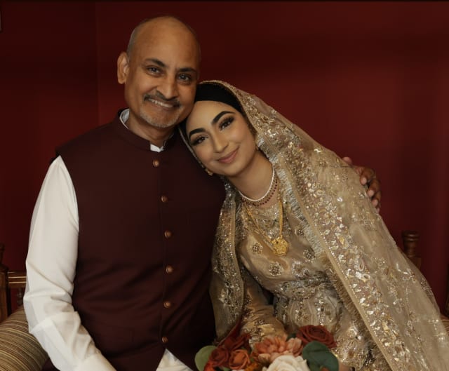 Dr. Faizal Sakukhan with his daughter Malaika, who wrote the foreword in his new book.